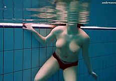 Czech chick vesta enters swimming pool naked. She bathes in the public shower.