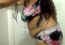 Can you resist this big-tit ebony MILF dancing seductively in the bathroom?