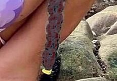 African beauty in bikini on the beach gets me jerking off.