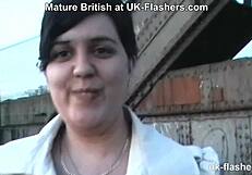 British chubby milf flashes and masturbates boldly in a public bar setting.