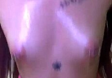 Young milf plays with oiled body and masturbates