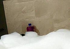 Cyno enjoys a relaxing bubble bath in cosplay.