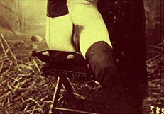 in this retro scene, a woman undresses and gives a blowjob