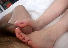 Czech Girl Gives Home Footjob in European Scene