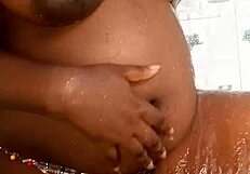 Ebony fucking herself in the bathroom