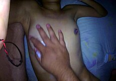 He gives an erotic massage to his stepsister, playing with her pussy as she moans in pleasure