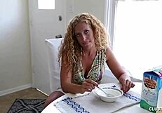 Naughty milf strokes a big cock in the kitchen!