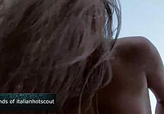 Hey, watch this stunning brunette mom take it in the ass on the beach!