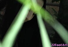 babes using feet to stroke cock outdoors in erotic scene