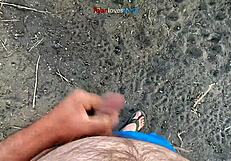 brunette masturbates cock under bridge in homemade solo