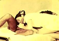 in a retro hospital, the vintage nurse cares for her patient with antique tools