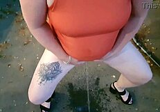 NZ milf slut pisses in public park and gets soaked! OMG, so wild! 🌧️