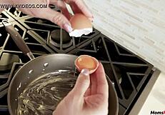 stepmom gives intense blowjob to stepson while he cooks in the kitchen