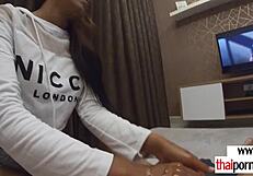 Petite Thai teen gives sensual handjob to big cock