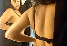 sarah rosa experiments with outfits in the store's fitting room