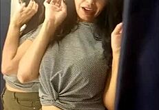 sarah rosa experiments with outfits in the store's fitting room