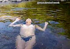 Brunette latina exhibitionist bathes in river with natural tits exposed and touches nipples