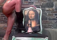 Oiled babe fucks giant dildo!