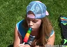 hey, that teen april is rubbing her clit outdoors while sucking on a popsicle, feeling so naughty with her brunette babe vibes
