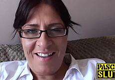 attractive busty milf relaxes on sofa