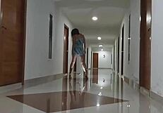 She rides black dildo up her dress without panties in hotel corridor