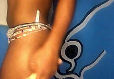 watch this ebony girl standing while stroking her tight pussy