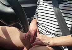 skinny brunette masturbates tight pussy outside car in closeup solo
