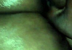 rubbin body oil on this ebony milf's big ass before fingering her hard