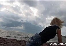 Sweet Sarah Kimble is showing her pussy in a closeup at the beach POV