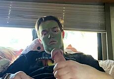 fit guy strokes cock while doing skin care