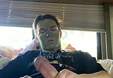 fit guy strokes cock while doing skin care