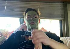 fit guy strokes cock while doing skin care