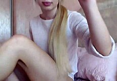 Pretty blonde teen fingers her pussy homemade