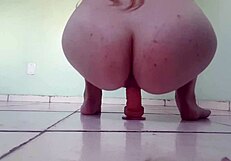 Amateur blond masturbates with a dildo and has a hairy pussy