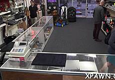 daring woman seduces in shop