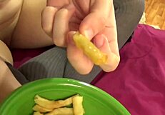 Amateur babe gets wild in bed and munches on cum-soaked fries after.