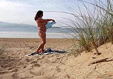 i filmed curvy milf changing and exercising on beach