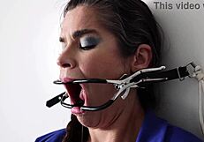 Extreme gag torment with mature slut nailed to wall
