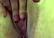 Using vibrator on her dry pussy lips