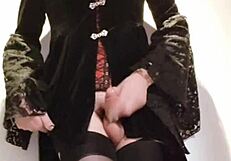 Selena the shemale rocks high heels and stockings, stroking in a long skirt.