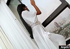 Asian shemale Natty teases solo with massive cock in lingerie