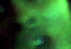 Ebony woman performing oral on a large black phallus