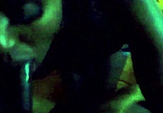 Ebony woman performing oral on a large black phallus