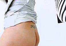 This busty asian ladyboy is solo, showing off her big tits and long hair in a private setting