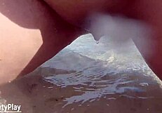 Shaved pussy peeing wildly on public beach!