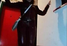 Femdom In Leather Catsuit