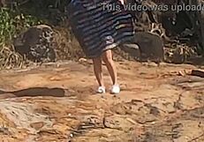 Stunning young African caught having outdoor sex on beach rocks