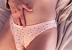 Stepdad rubs wet shaved pussy, then spills cum in her panties.