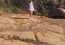 Stunning young African caught having outdoor sex on beach rocks