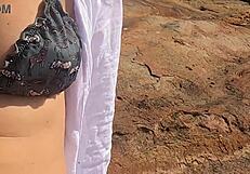 Stunning young African caught having outdoor sex on beach rocks